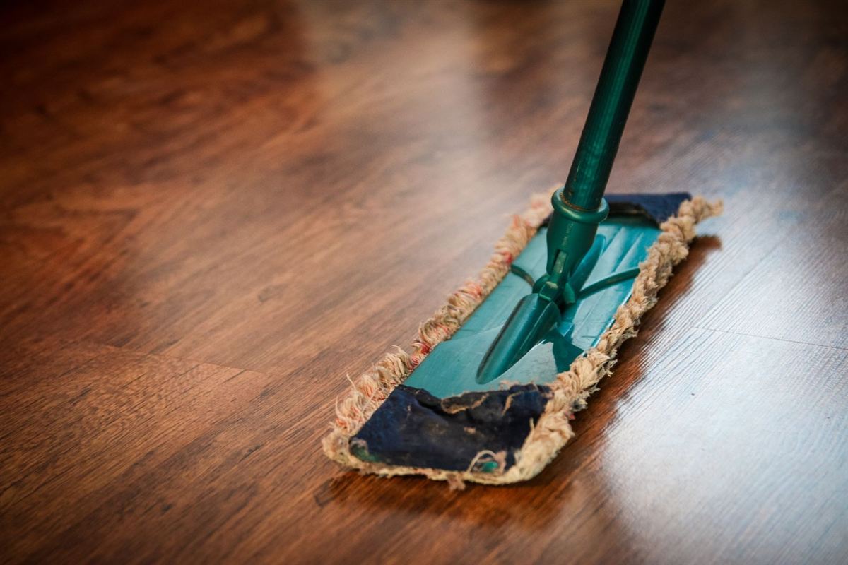 Dust mop cleaning a hardwood floor