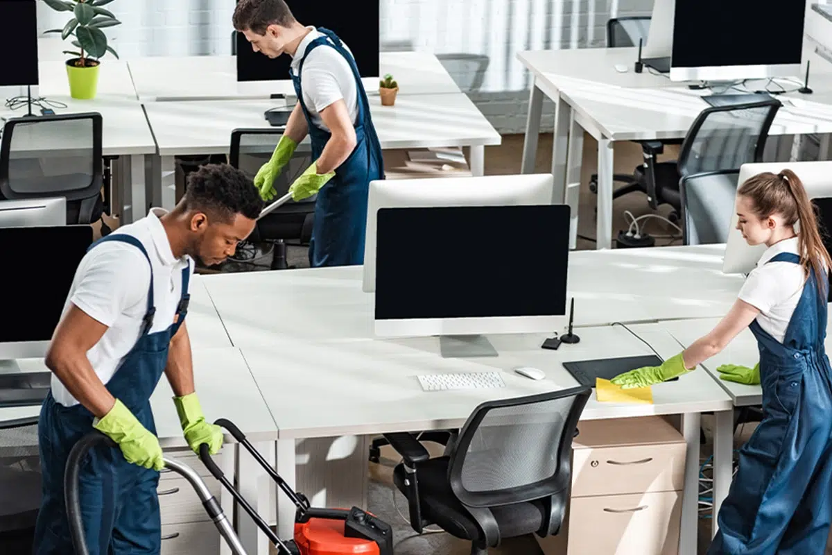 Office cleaning crew disinfecting desks and workspaces in Charlotte
