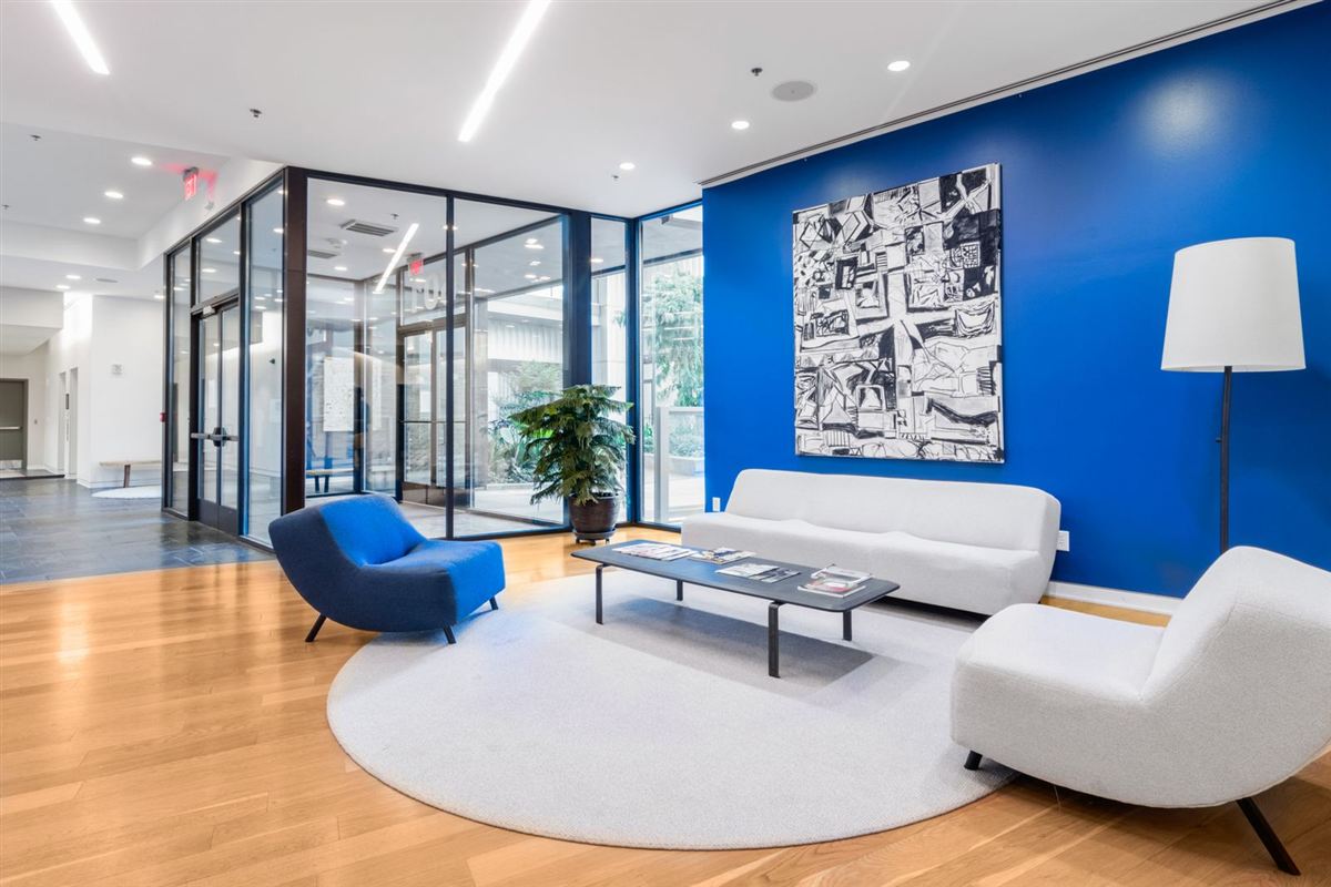 Shared lounge area with seating in a residential community building
